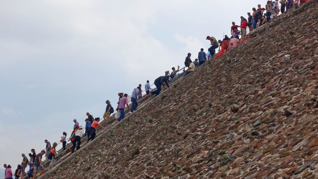 Tourists pass each other on the stairs of the Pyramid of the Sun.