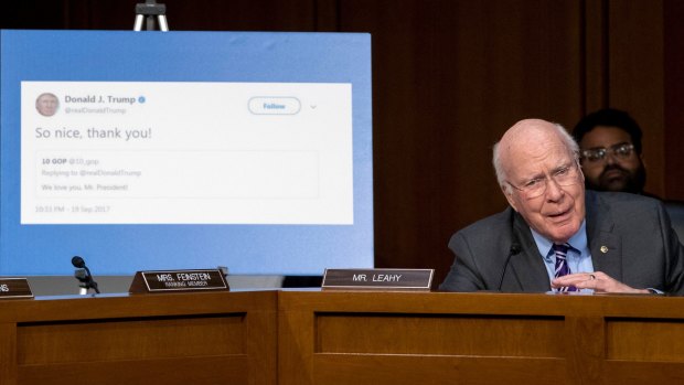 Senator Patrick Leahy speaks next to a poster depicting a tweet from President Donald Trump that he says was a retweet from an account that spreads factually incorrect information.