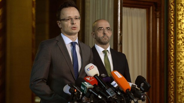 Hungarian Minister of Foreign Affairs and Trade Peter Szijjarto, left, on Wednesday announcing the plan to fence the Hungarian-Serbian border.