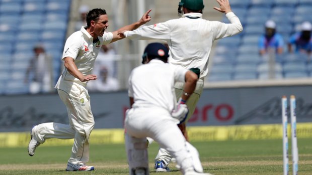 Breakthrough: Steve O'Keefe celebrates the wicket of Virat Kohli.