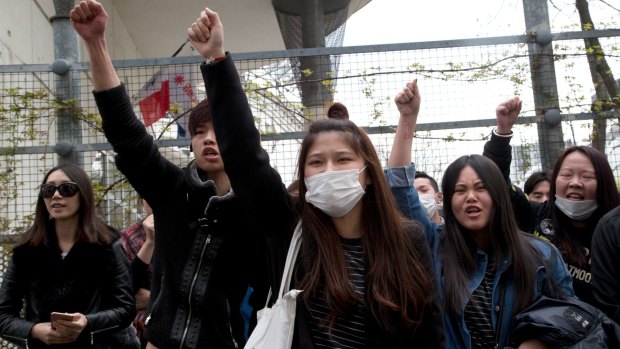 French-Chinese protest outside the Paris 19th district police station on Tuesday.