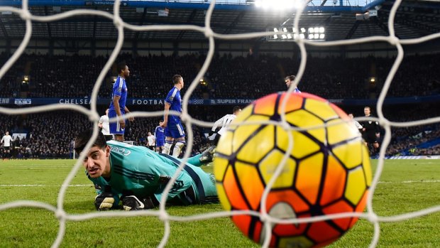 One that got away: Chelsea keeper Thibaut Courtois reacts after Kevin Mirallas scores Everton's second goal at Stamford Bridge.