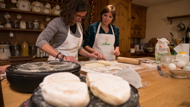 Visitors enjoy the art of baking with NI Food Tours.