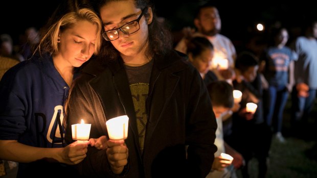 Residents of Sutherland Springs hold a vigil for victims, half of whom were children. 