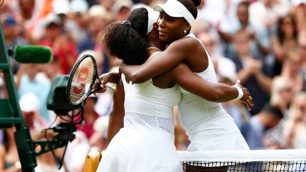 Wimbledon legends: The sisters hug after the match.