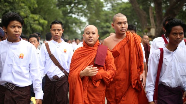 Nationalist Buddhist monk Wirathu marches to celebrate newly imposed restrictions on interfaith marriages in Mandalay.