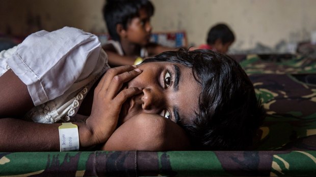 A Rohingya girl resting at a temporary refugee shelter in Aceh, Indonesia, in May.