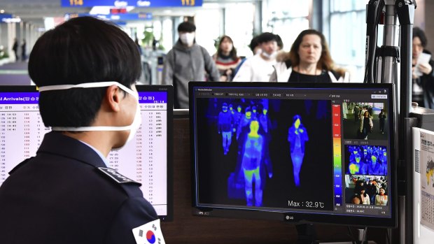 A thermal camera checks the temperature of passengers arriving at Incheon International Airport in South Korea.