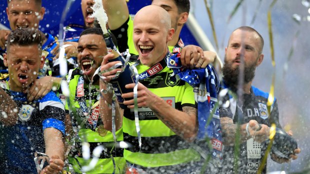 Huddersfield Town's Aaron Mooy celebrates winning the Championship play-off final at Wembley.