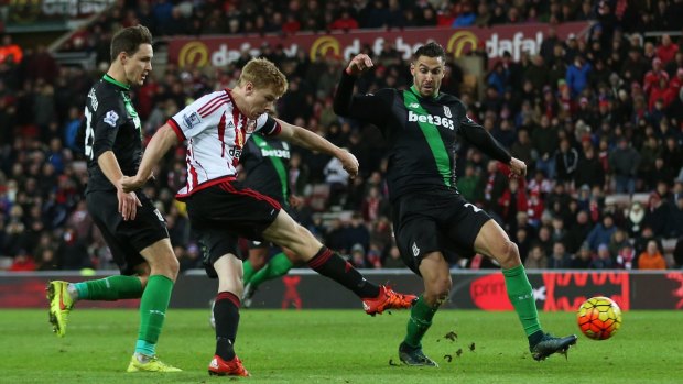 In it goes: Duncan Watmore scores his team's second goal during Sunderland's Premier League win over Stoke City at Stadium of Light.