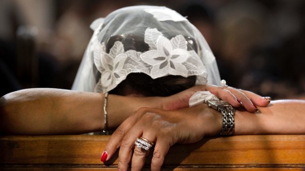 A Coptic Christian grieves during prayers.