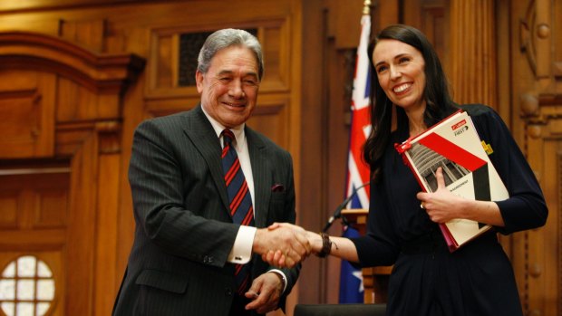 New Zealand First leader Winston Peters, left, and Prime Minister-designate Jacinda Ardern shake hands after signing a coalition agreement on October 24.