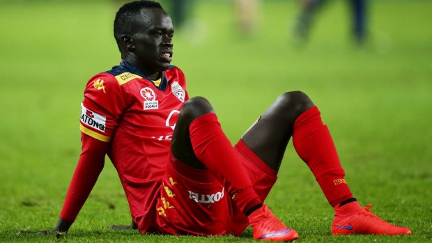 Bad night gets worse: Adelaide's Awer Mabil.