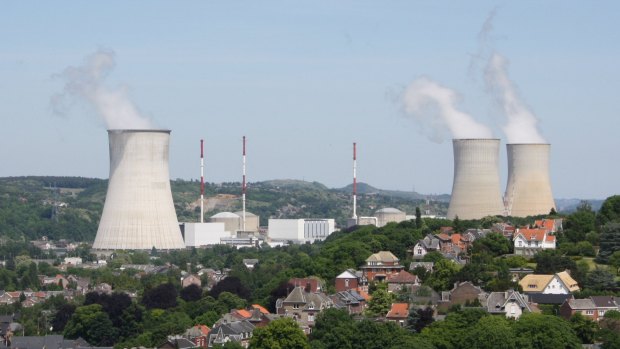 A guard who worked at a Belgian nuclear plant has been  murdered and his pass stolen. Pictured is Tihange nuclear power station in Huy.