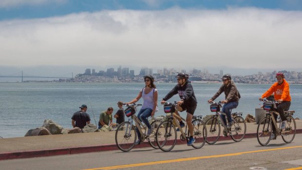 Tourists ride across the Golden Gate Bridge to Sausalito, which has great views back to San Francisco.