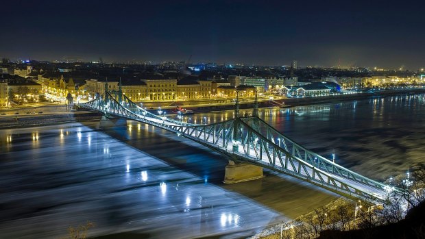 In this picture taken with a long time exposure, drift ice or ice floes float in the water of River Danube at the Szabadsag (Freedom) Bridge in Budapest, Hungary.