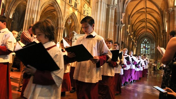 Crowds take part in the Christmas Day Mass at St Mary's Cathedral on Sunday.