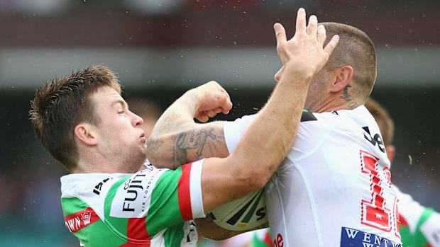 Red and white opportunity: Luke Keary tackles Joel Thompson during South Sydney's clash with the Dragons at the Sydney Cricket Ground in March.