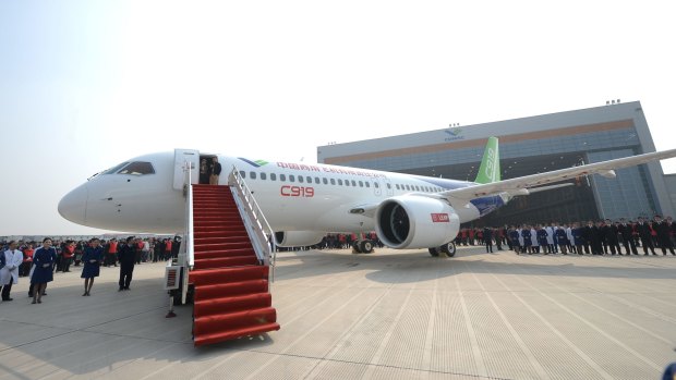 China's answer to the Boeing 737 and its state-owned designers face a daunting phase: selling the jet abroad in a market dominated by Boeing and Airbus .