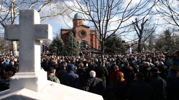 A huge crowd attends the funeral of Kosovo Serb politician Oliver Ivanovic.