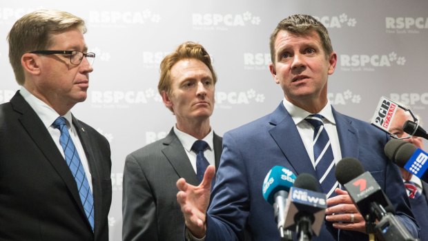 NSW Premier Mike Baird, right, joined by Deputy Premier Troy Grant, left, and RSPCA chief executive Steven Coleman, announces the details for the greyhound racing transition plan at the RSPCA Centre at Yagoona in Sydney, in July. 