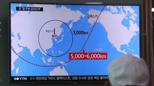 A TV news report on the range of North Korea's missiles at the Seoul Train Station in South Korea.