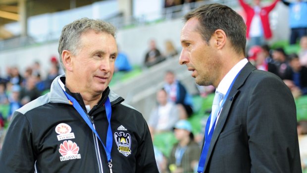 From coach to coach: Ernie Merrick of Wellington Phoenix and John van 't Schip of Melbourne City exchange pleasantries before Sunday's game.