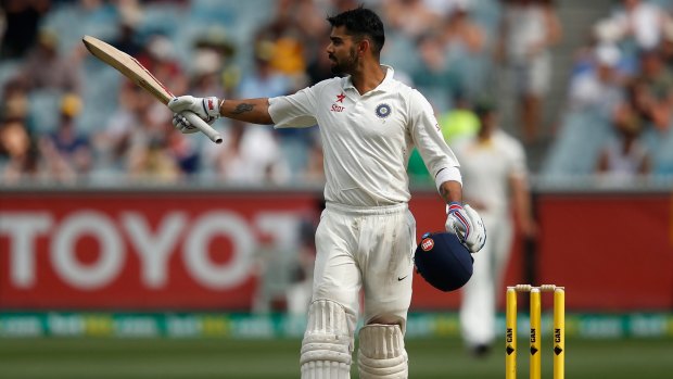 India vice-captain Virat Kohli acknowledges the MCG crowd on reaching 150 on day three of the Boxing Day test at the MCG.