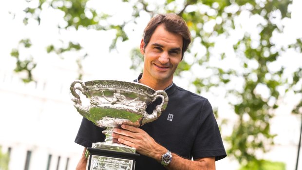 Roger that: Roger Federer with the trophy on Monday.