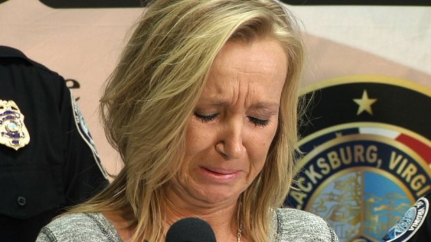Nicole's mother Tammy Weeks cries as she speaks to reporters in Blacksburg, Virginia. 