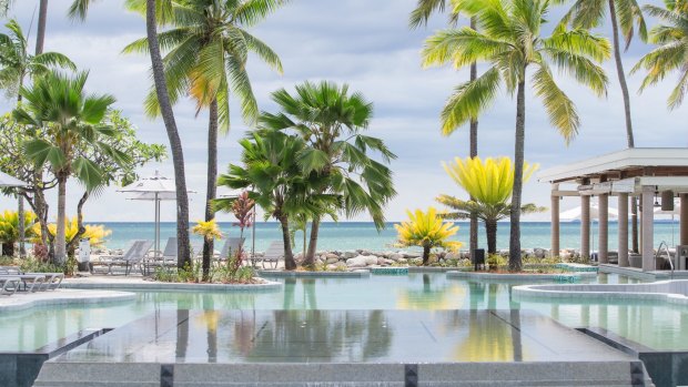 The resort's central pool faces the beachfront with the requisite number of shady palm trees, beach chairs and a swim-up bar. 