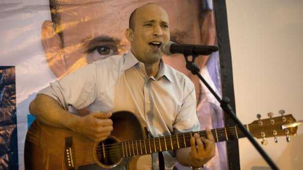 Naftali Bennett sings on the campaign trail in the occupied West Bank settlement of Kfar Etzion.