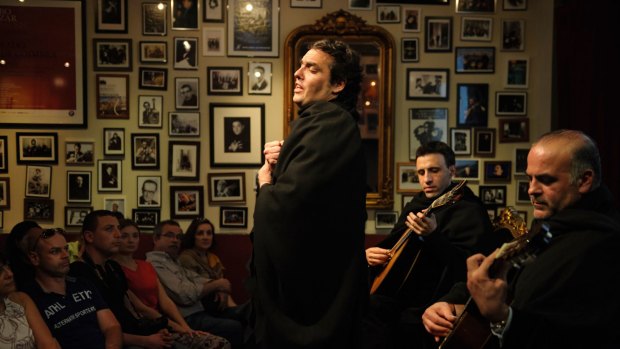 A Fado singer and musicians in Portugal.