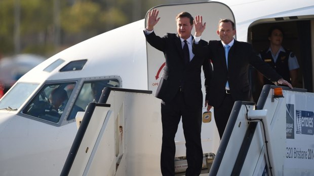 British Prime Minister David Cameron and Australian counterpart Tony Abbott arrive in Brisbane.