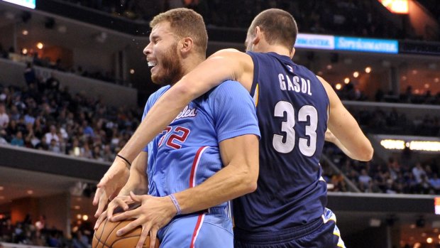 No way through: Clippers forward Blake Griffin is manhandled by Memphis star Marc Gasol.