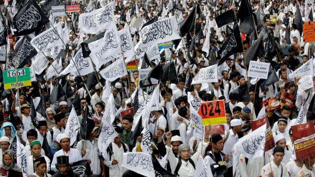May 2015: members of Hizbut Tahrir Indonesia wave flags during a rally calling for the creation of a caliphate and for sharia to be the law of the land in Jakarta.  