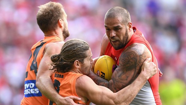 Giants apply relentless pressure on Swans star Lance Franklin.