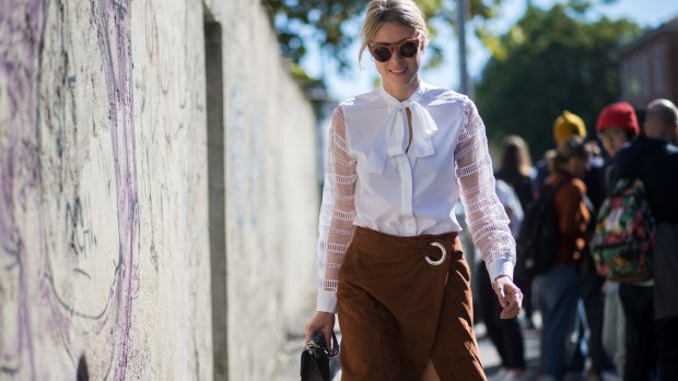 Blogger and stylist Sofie Valkiers shows how to balance the heaviness of a suede skirt with a flowy blouse. 