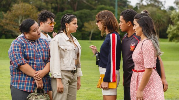 The Breaker Upperers, right, Jackie van Beek in striped top as Jen and Madeleine Sami in pink dress (Mel) with James Rolleston (James) as they confront his girlfriend Sepi (played by Ana Scotney).