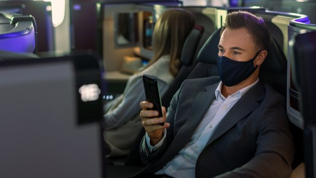 The new business class seats feature wireless charging for mobile devices.