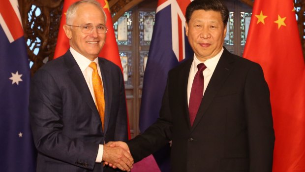 Australian Prime Minister Malcolm Turnbull, left, and Chinese President Xi Jinping shake hands before their meeting in Beijing in April.