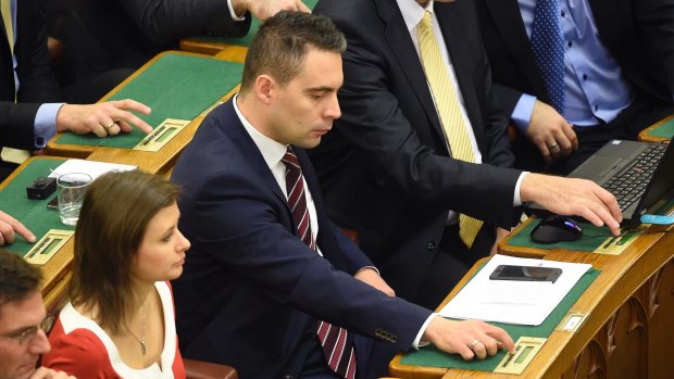 Chairman of the far-right opposition Jobbik party Gabor Vona, centre, prior to the vote.