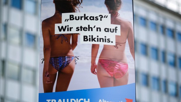 An election campaign poster of the German nationalist anti-migrant party AfD, Alternative for Germany, reading "Burkas? We like bikinis." is displayed in Berlin.