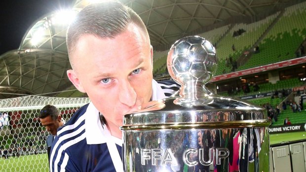Sealed with a kiss: Besart Berisha after Melbourne Victory's FFA Cup win.