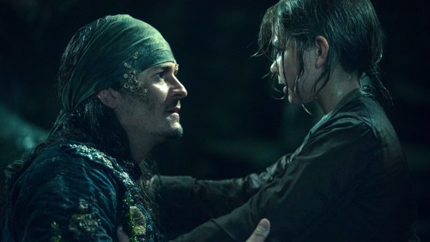 Brought back: Orlando Bloom as Will Turner, left, with Lewis McGowen as young Henry Turner in a scene from Pirates of the Caribbean: Dead Men Tell No Tales.