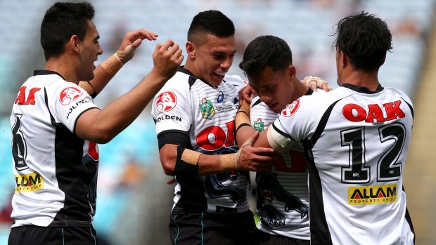 Under 20 champions: Jarome Luai celebrates with Penrith teammates after scoring a try against the Manly-Warringah Sea Eagles at ANZ Stadium.