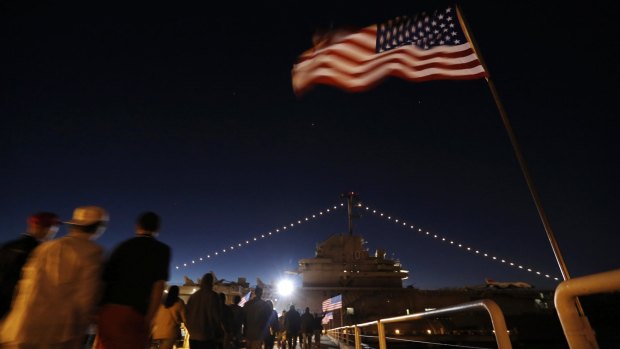 Supporters on their way to hear Donald Trump speak during a rally coinciding with Pearl Harbor Day aboard the aircraft carrier USS Yorktown in South Carolina.