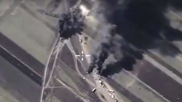 Footage taken from Russian Defence Ministry website on Christmas Day shows a target hit during a Russian air raid to eliminate a concentration of oil transporting vehicles in Syria. 