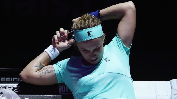 Bad hair day: Svetlana Kuznetsova hacks off her hair.