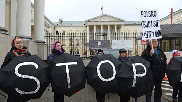 A group of civic rights activists stand in front of City Hall during an Independence March in Warsaw, Poland, on November 11.